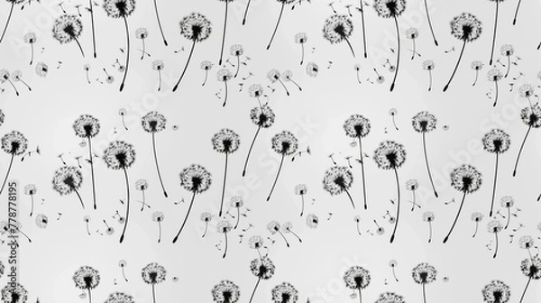 Fototapeta A black and white floral pattern with dandelions. The dandelions are scattered throughout the image, with some in the foreground and others in the background