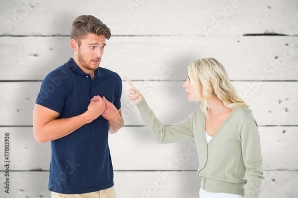 Fototapeta Composite image of woman accusing her guilty looking boyfriend