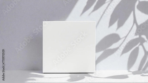 Fototapeta Soft shadows from leaves on a white wall. Square white mockup