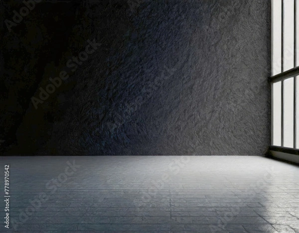 Fototapeta Open space in a large room with black walls and gray floor. Incident light from the window on the right