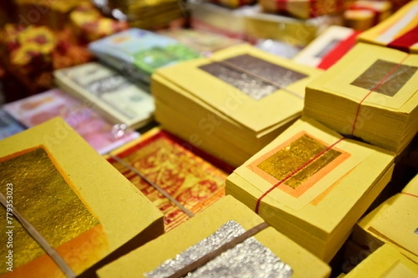 Fototapeta Taiwan - Jan 18, 2024: Hell money, also called spirit money, is paper burned as an offering to ancestors in Chinese worship. It's believed to provide them with what they need in the afterlife.