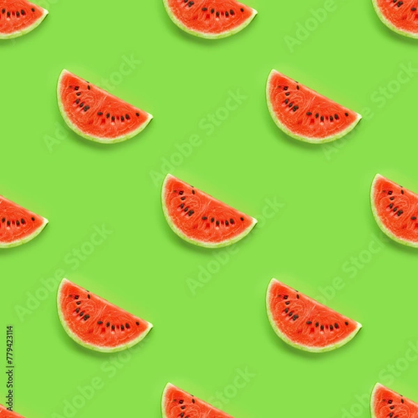 Fototapeta Colorful  fruit seamless pattern of fresh watermelon slices on bright green background. Flat lay summer background.