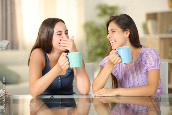 Fototapeta Woman laughing hidding mouth with her hand