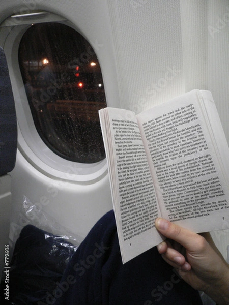 Obraz reading a book on the plane