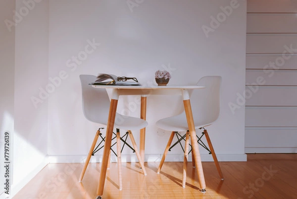Fototapeta round table in interior with parquet floor and white wall