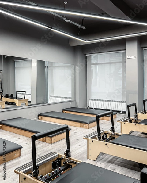 Fototapeta A row of Pilates machines at the gym, 