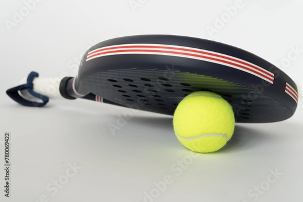 Obraz blue professional paddle tennis racket with yellow ball on white background. copy space for text