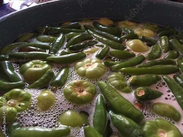 Fototapeta tomato sauce or tomatillo in case to boil with chili garlic and tomato