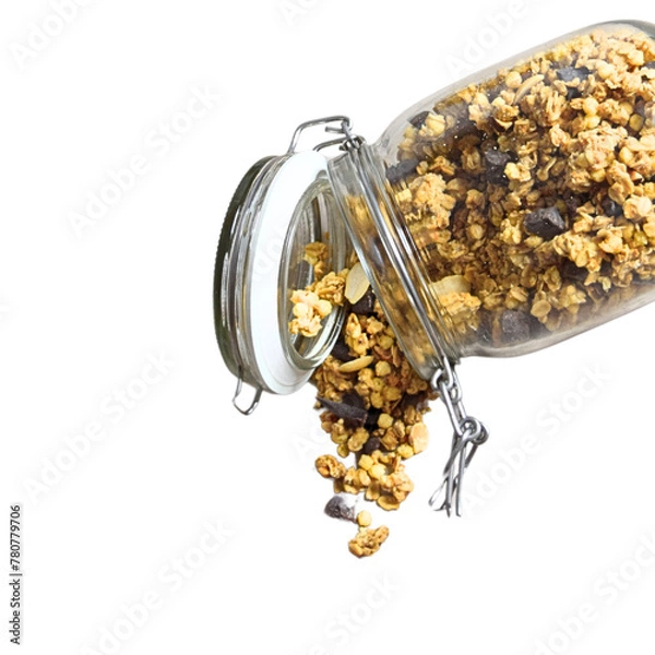 Fototapeta Natural muesli with chocolate falling from the open glass jar on white background