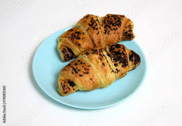 Fototapeta Handmade croissant with chocolate on blue plate on white background 