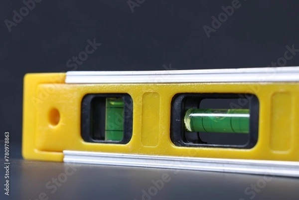 Obraz Building level on dark background, closeup view