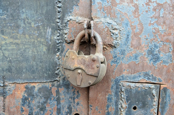 Obraz Old, metal padlock locking an iron gate