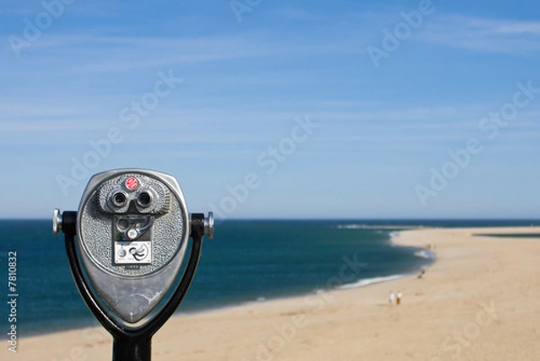 Obraz Coin operated binoculars for beach observation, blue sky and oce
