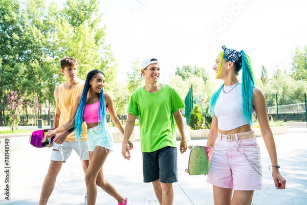 Fototapeta Group of professional skaters teens at the skatepark