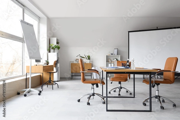 Obraz Interior of light conference hall with screen board, table and armchairs