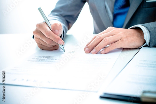 Obraz Business man signing a contract
