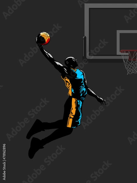 Obraz Basketball player jumps to dunk