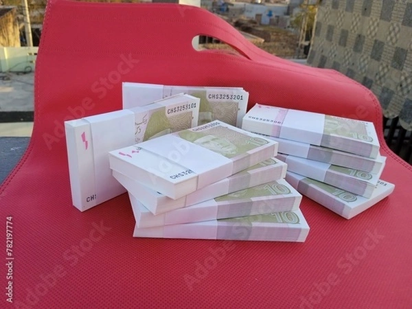 Fototapeta Bundle of Pakistani Currency. 10 Rupees note Pakistani, Pakistani currency note PKR 10 rupees. Heap of Pakistani currency bundle