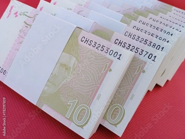 Fototapeta Bundle of Pakistani Currency. 10 Rupees note Pakistani, Pakistani currency note PKR 10 rupees. Heap of Pakistani currency bundle