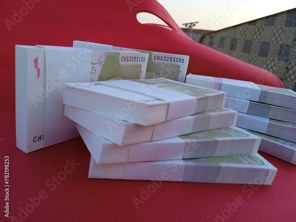 Fototapeta Bundle of Pakistani Currency. 10 Rupees note Pakistani, Pakistani currency note PKR 10 rupees. Heap of Pakistani currency bundle
