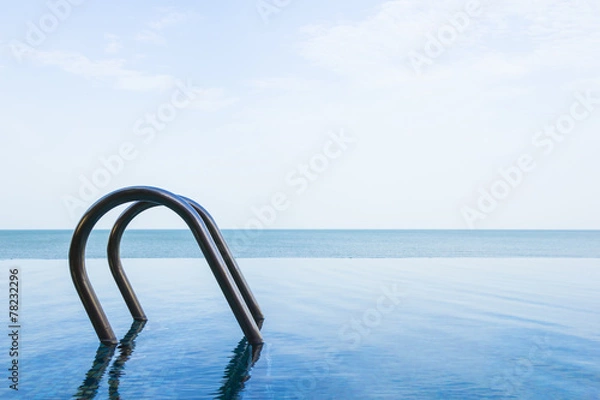 Obraz Sea view of infinity swimming pool with sky