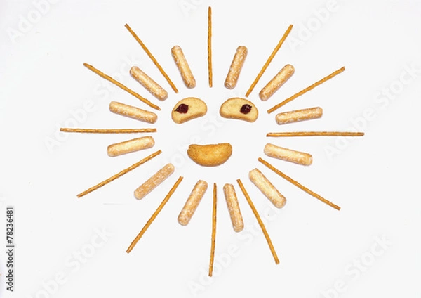 Fototapeta Cheerful sun of bread sticks on white background