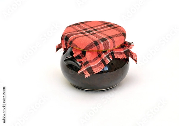 Fototapeta jar of jam tied with a checkered headscarf