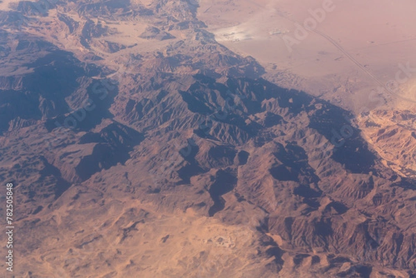 Fototapeta Aerial view of the mountains and sandy plateau of Egypt, the Sinai Peninsula. Aerial photography.