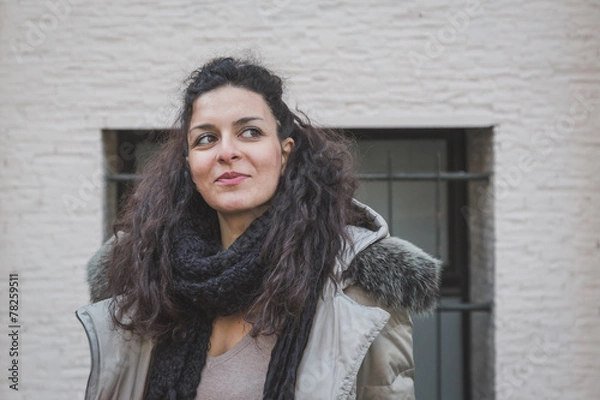 Obraz Beautiful young brunette posing in the city streets