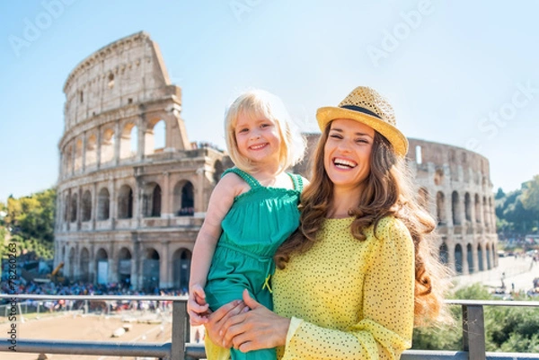Obraz Portrait of happy mother and baby girl in front of colosseum