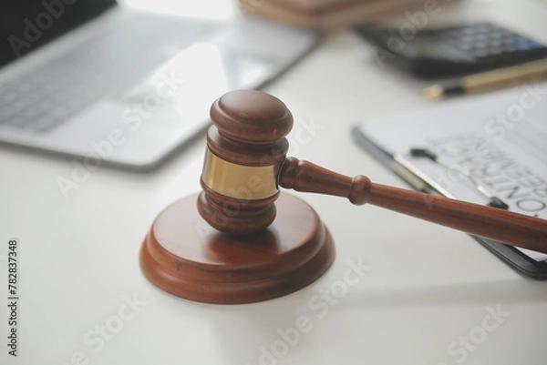 Fototapeta Lawyer, legal advisor, businessman brainstorming information on agreement details Business contracts in legal processing books for accuracy in contract documents. joint financial investment.