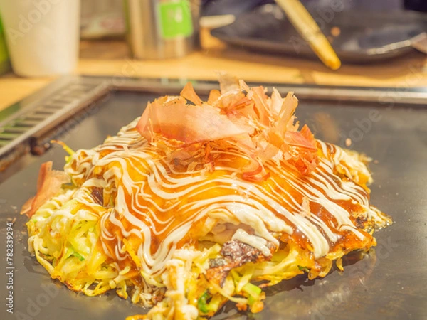 Obraz Okonomiyaki on an iron pan in Japan