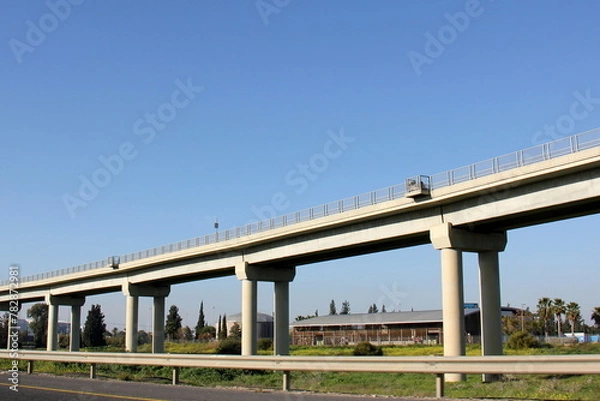 Fototapeta The bridge was built over a gorge and a water obstacle.