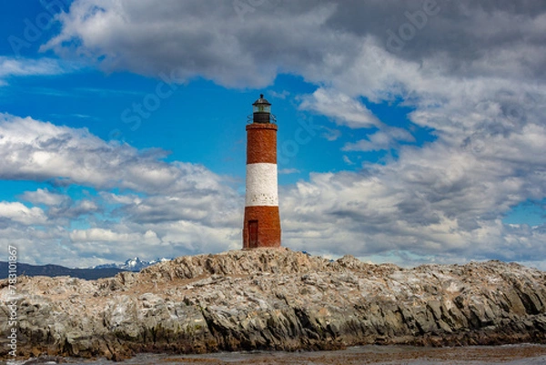 Obraz Lighthouse under a cloudy sky