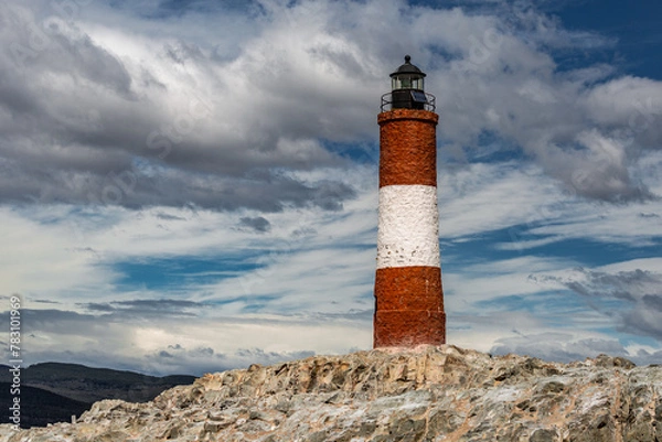 Obraz Lighthouse under a cloudy sky