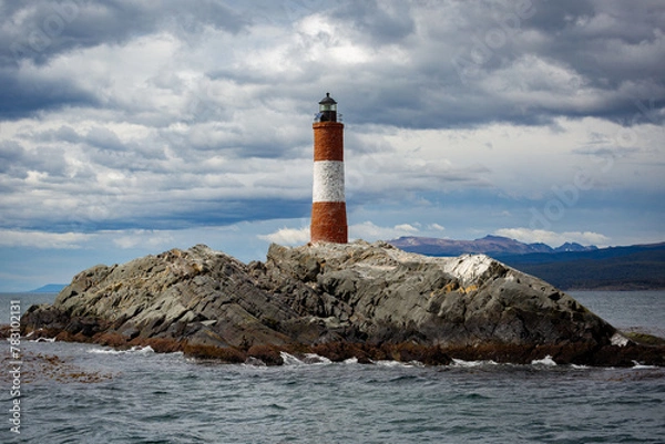 Obraz Lighthouse under a cloudy sky