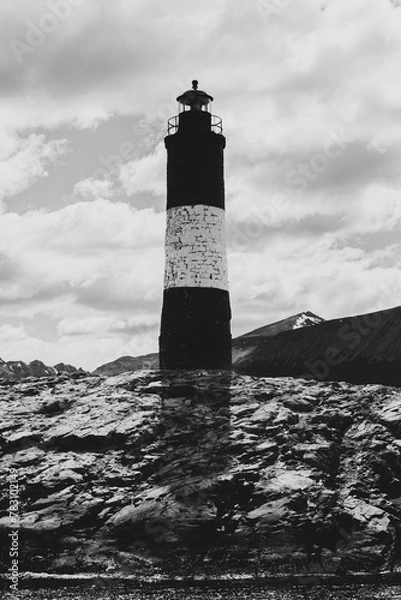 Obraz Lighthouse under a cloudy sky