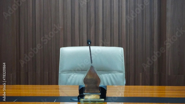 Obraz selective focus table microphone with white chair in the meeting room for teleconference                                                                                                