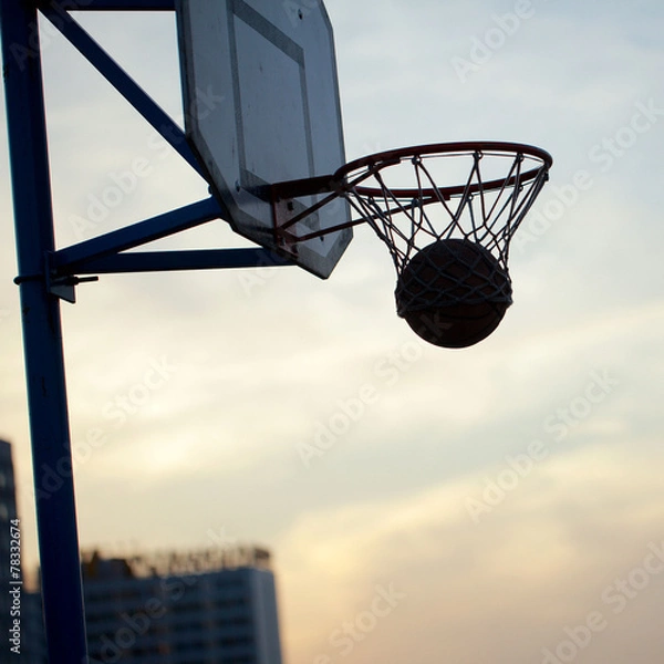 Fototapeta hoops basketball game on the streets ring with a net