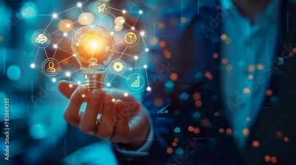 Fototapeta Businessman holding a light bulb in his hands, symbol of a new innovative idea of business technology, financial marketing network, profit planning strategy, developing analytical solutions