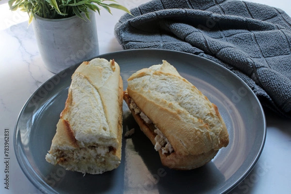 Obraz Chicken salad on a toasted baguette bun for lunch.