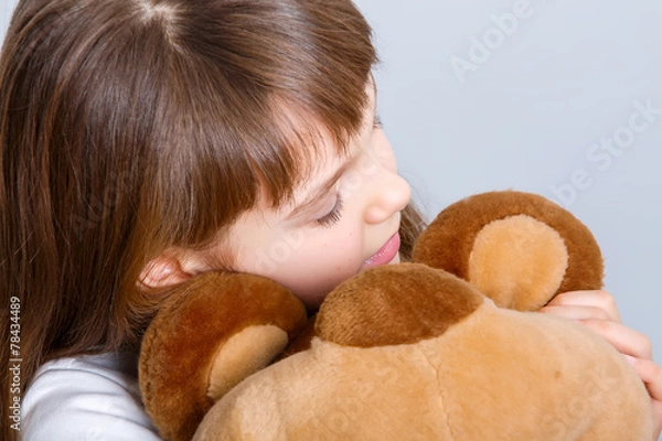 Fototapeta girl hugging bear