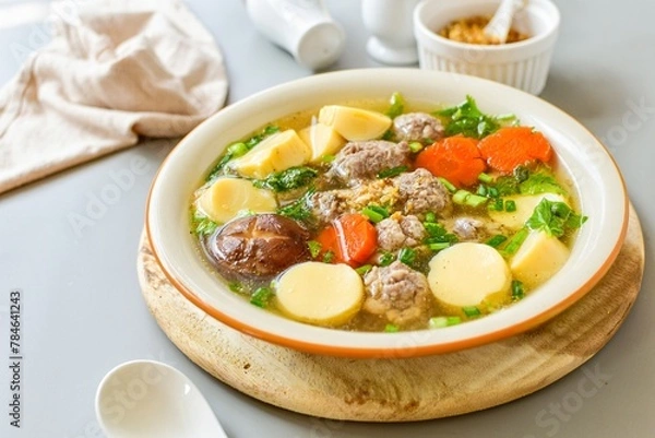 Fototapeta Clear Soup with Bean Curd and Minced Pork and seaweed , top view food,Clear Soup with Egg Tofu ,vegetable and Minced Pork ball ,thai food,Thai call kang jued tao hoo moo sab