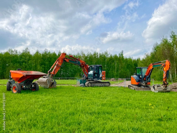 Fototapeta Mini crawler excavator for laying utilities on construction sites