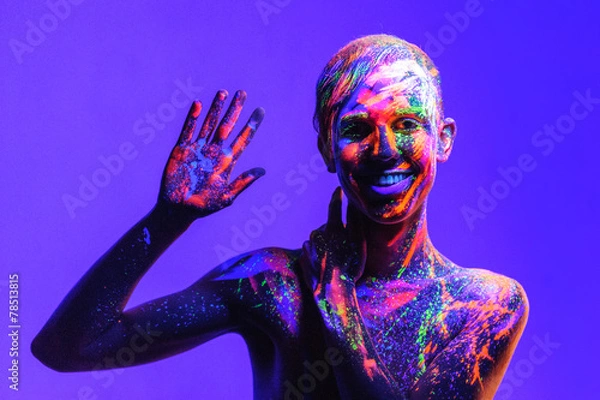 Fototapeta Man covered with fluorescent paint on color background