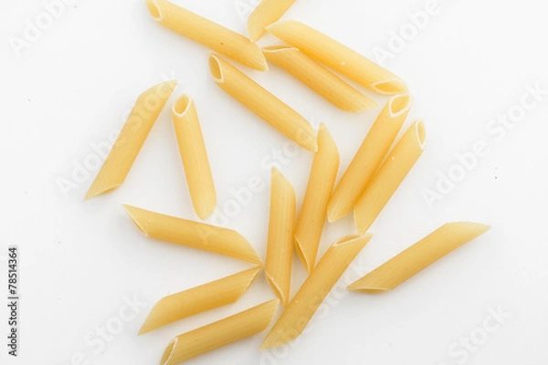 Obraz uncooked penne isolated on white background