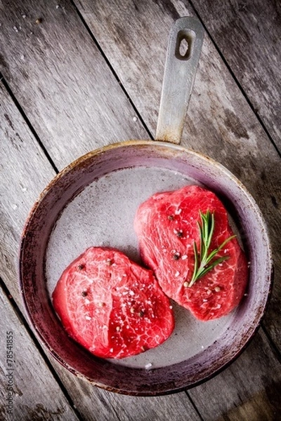 Obraz Two raw steaks in the pan
