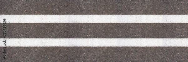 Fototapeta Empty highway black asphalt road and white dividing lines, Top view