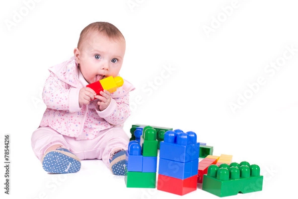Fototapeta child boy playing with block toys over white background