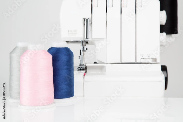Fototapeta Sewing threads on reflective surface